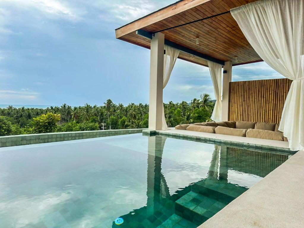 Πισίνα στο ή κοντά στο Villa Jasmine -4br Boho designed pool villa