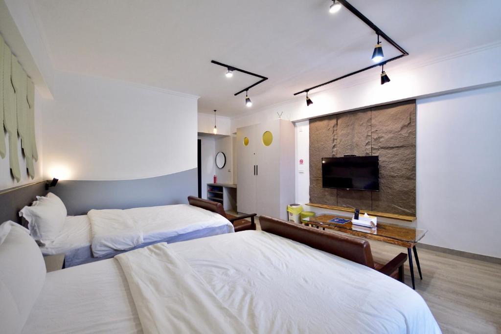 Ένα ή περισσότερα κρεβάτια σε δωμάτιο στο Zhiben Wu Jiari