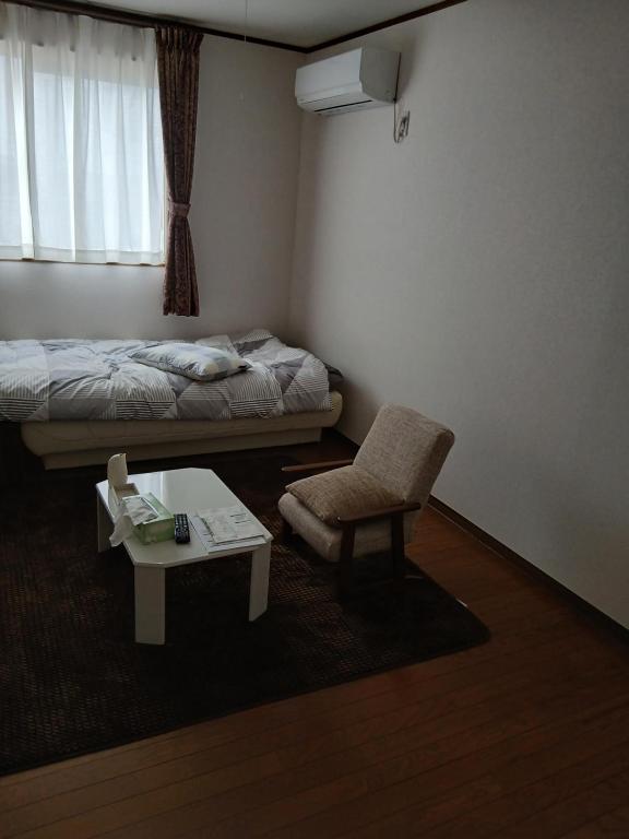 Ένα ή περισσότερα κρεβάτια σε δωμάτιο στο れのん