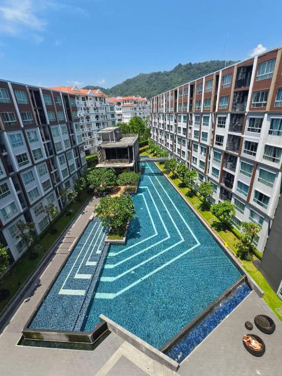 an aerial view of an apartment complex with a swimming pool at The Azure Kathu in Kathu