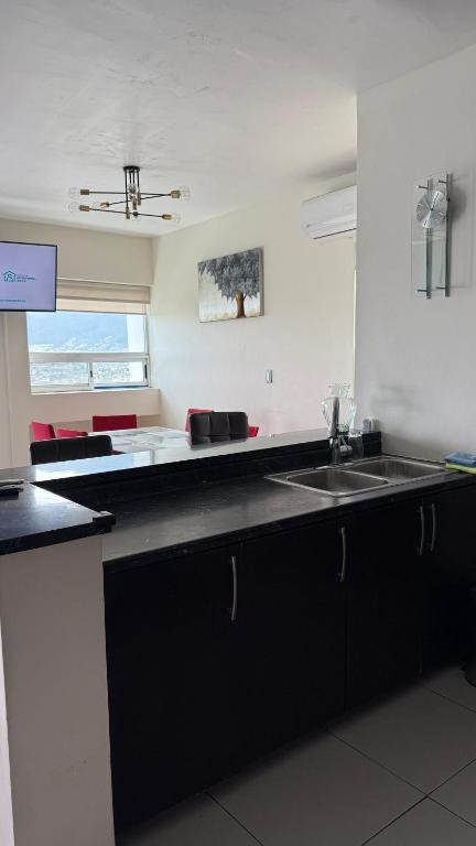 Η κουζίνα ή μικρή κουζίνα στο Encantador y cómodo departamento en Linda Vista HI