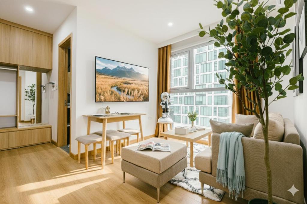 a living room with a couch and a table at Label6 Studio West Lake in Hanoi