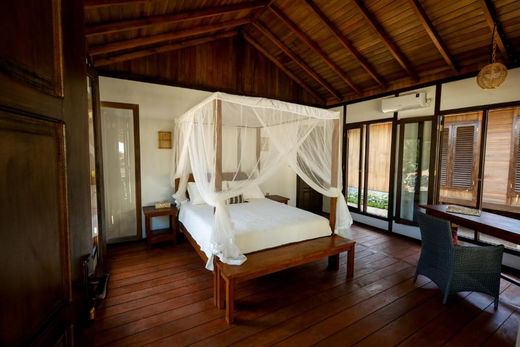 Postel nebo postele na pokoji v ubytování Bobocha Tangkoko Nature Resort