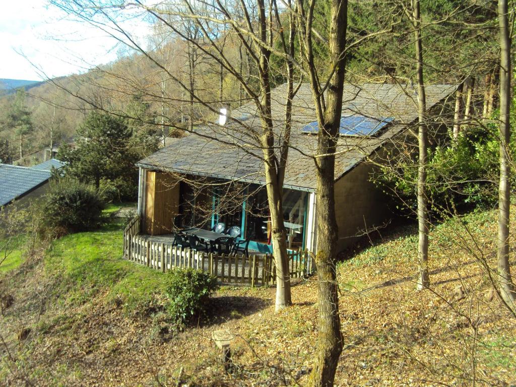 a small house with a porch and a fence at Le Vieux Sart 1 in Stavelot