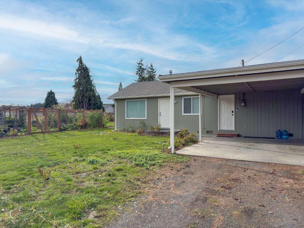 a house with a yard with a driveway at The Garden Gate in R Corner