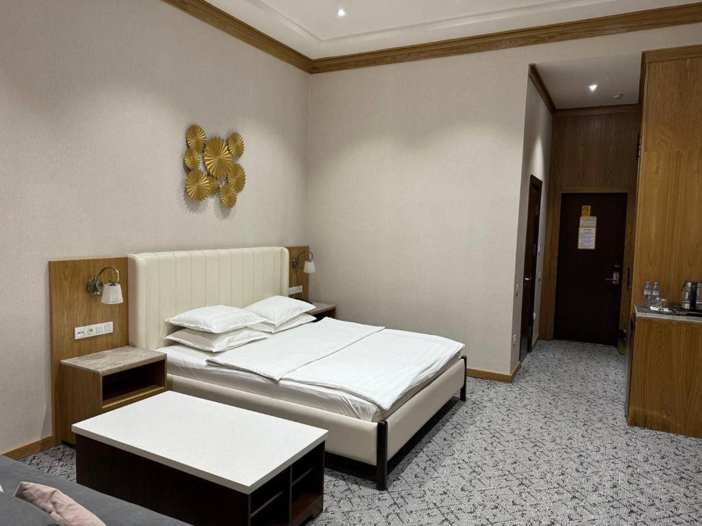 Ένα ή περισσότερα κρεβάτια σε δωμάτιο στο Hotel Elegant