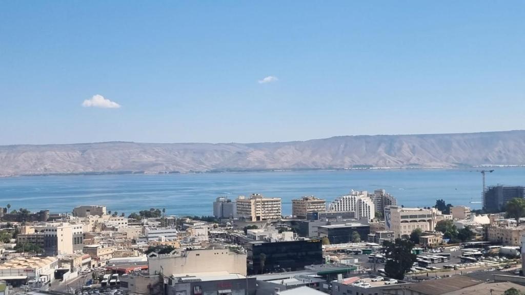 an aerial view of a city and the ocean at דירת נופש לב ים in Tiberias