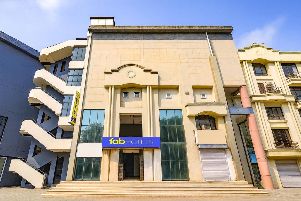 a building with a sign that reads top hotels at FabHotel Crescent in Faridabad