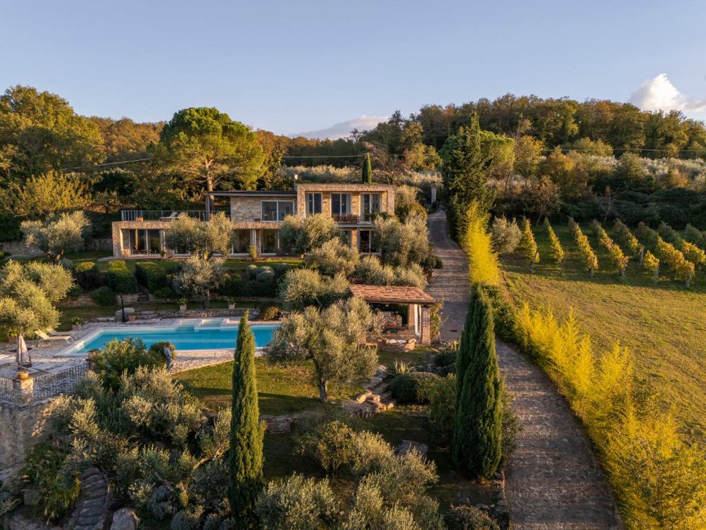 an aerial view of a villa with a swimming pool and trees at BRIGHTLINE VILLA 8, Emma Villas in Asproli
