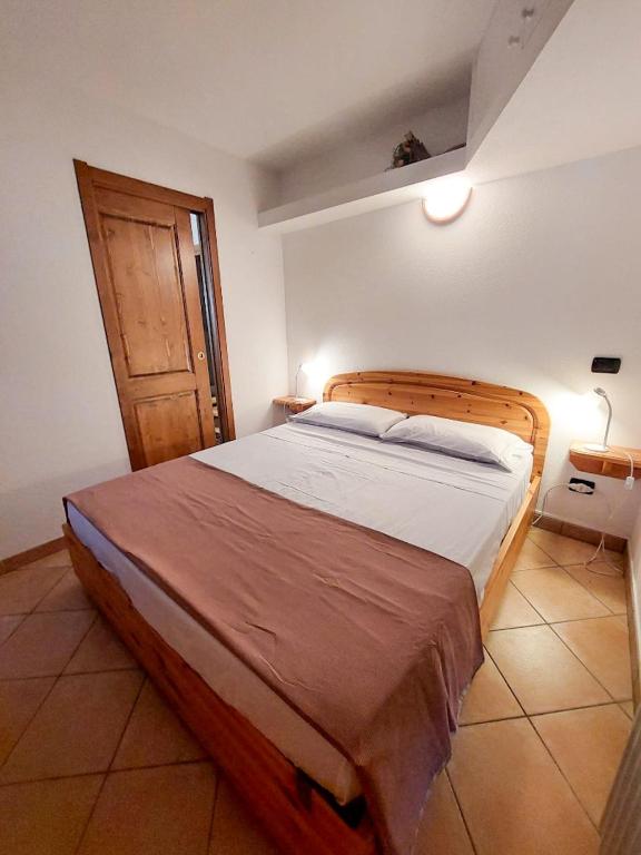 Ένα ή περισσότερα κρεβάτια σε δωμάτιο στο Lo chalet di Lucky