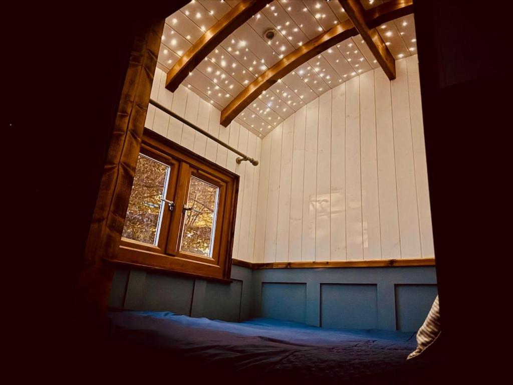 a room with a window and a bed in it at Worcester Escape in Hallow