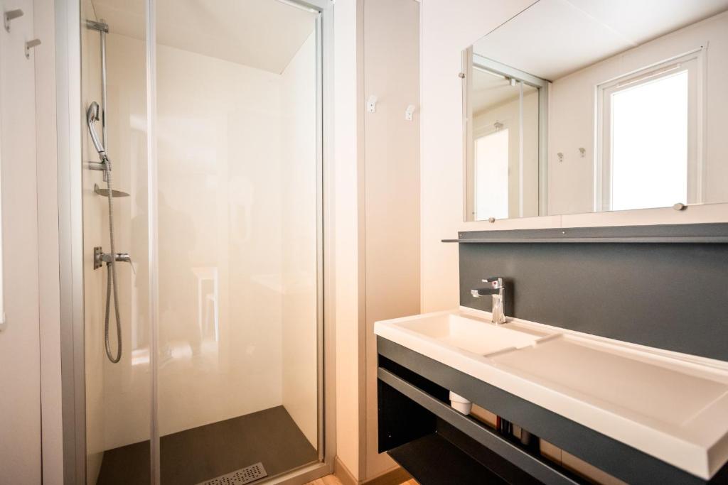 a bathroom with a sink and a shower at Rives d'Arc in Vallon-Pont-dʼArc