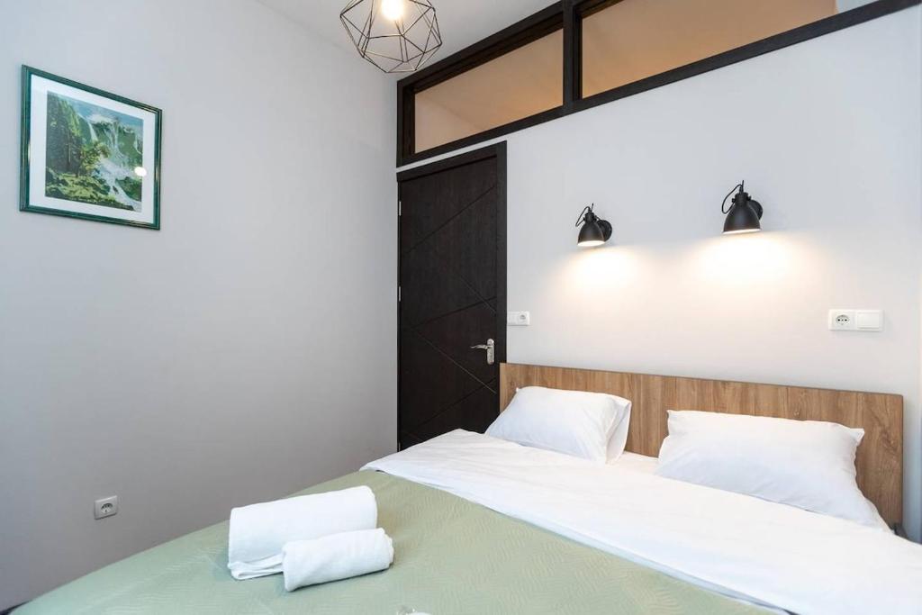 Llit o llits en una habitació de Wehost Cozy Nest