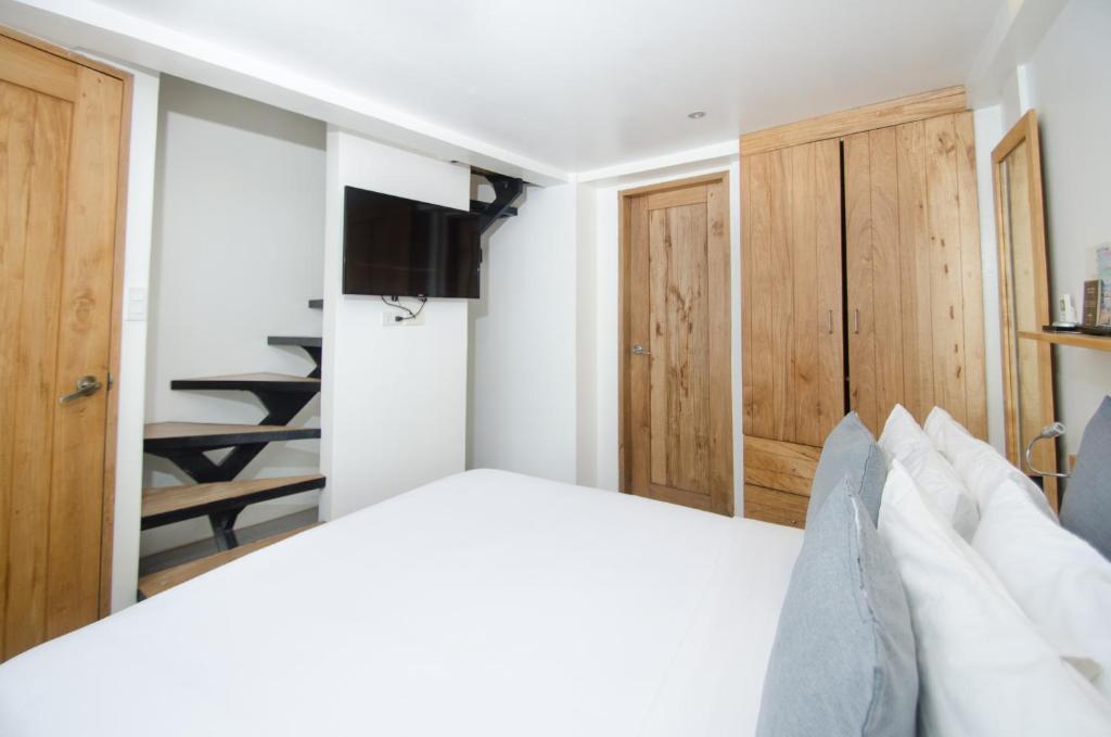 Postel nebo postele na pokoji v ubytování Zuzuni Boutique Hotel