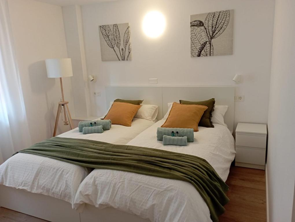 Ένα ή περισσότερα κρεβάτια σε δωμάτιο στο Habitaciones Algodón con baño propio