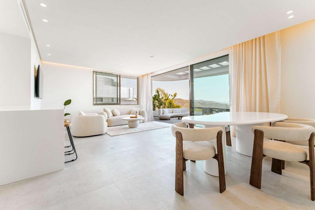 a living room with a white table and chairs at Palo Alto 9 Panoramic Views Terrace Luxury in Monda