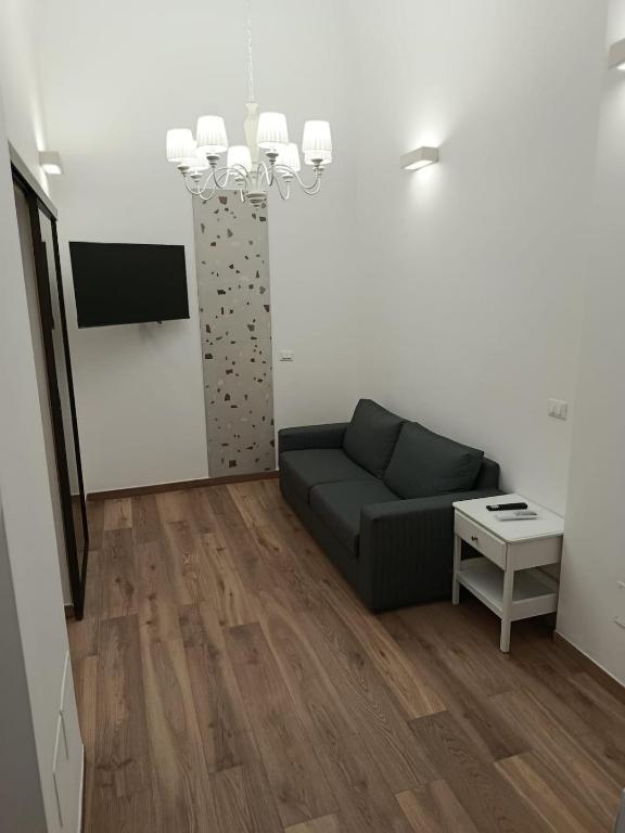 a living room with a couch and a table at Ionian Breeze in Taranto