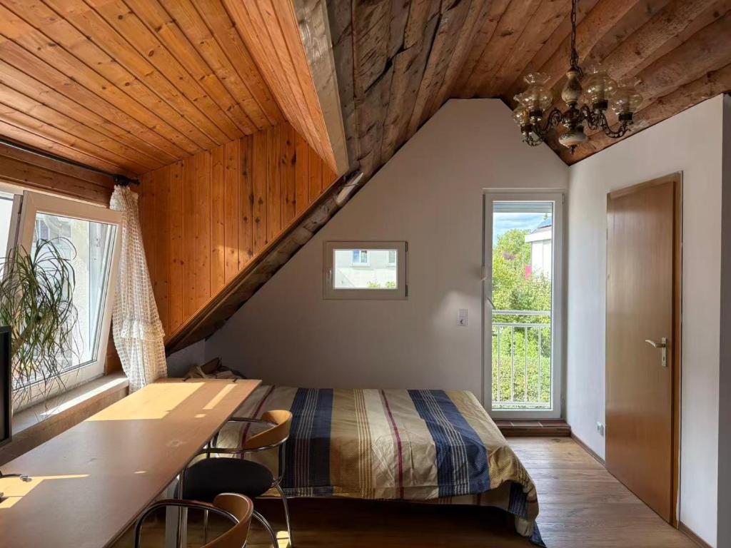 Ένα ή περισσότερα κρεβάτια σε δωμάτιο στο Martin's Apartment at Kirchheim near train station