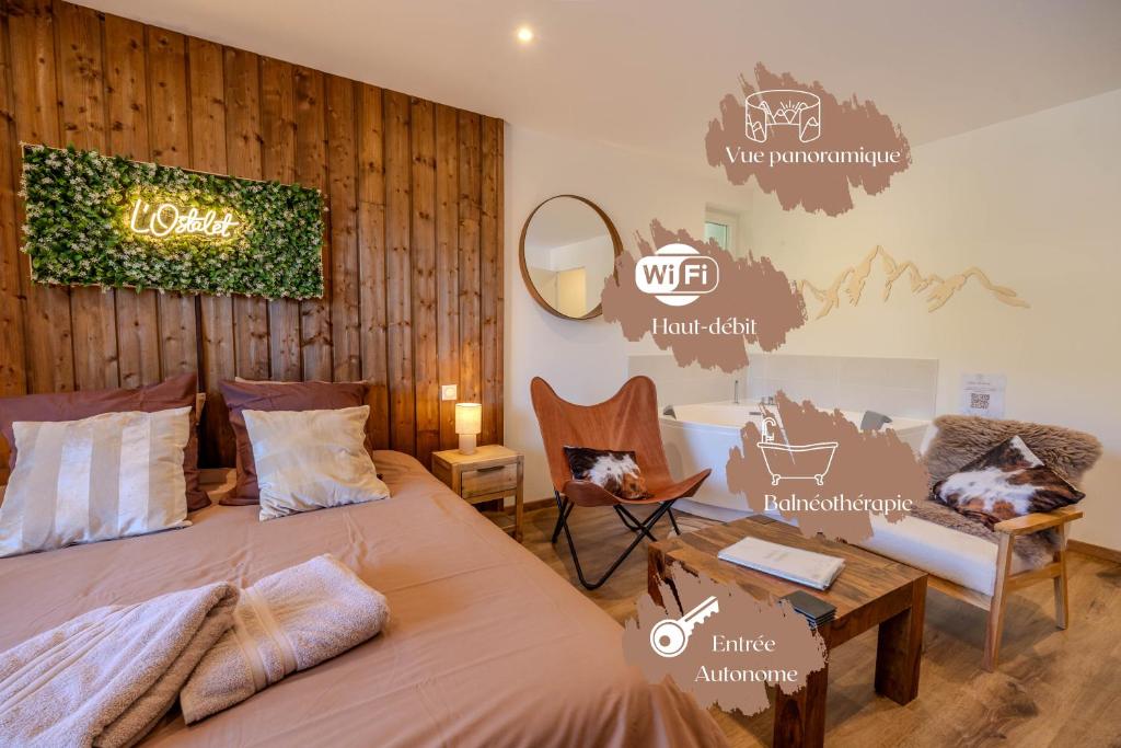 a bedroom with a bed and a table and a chair at L'Ostalet suite luxe Jacuzzi in Ax-les-Thermes