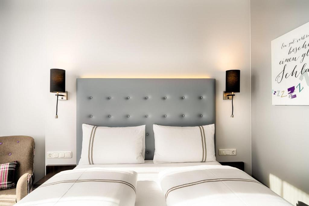 Postel nebo postele na pokoji v ubytování Premier Inn München City Ost