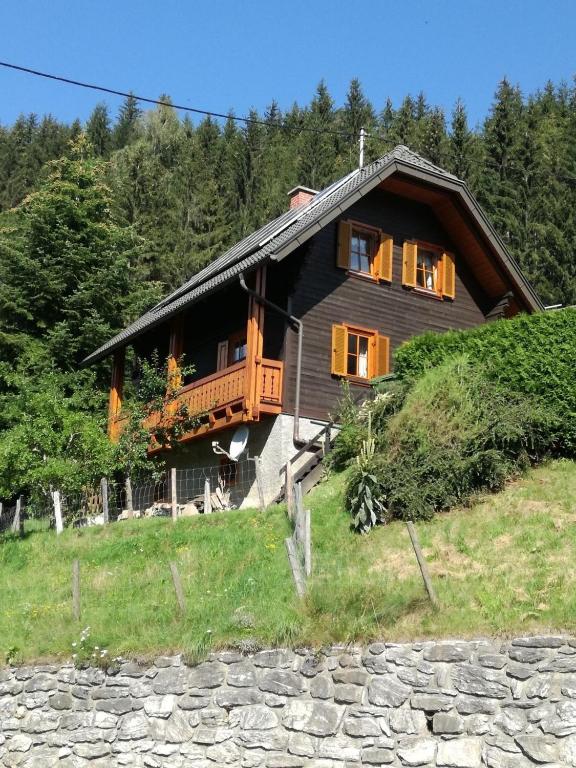 a house on top of a hill with trees at Jägerkeusche in Unterpreitenegg