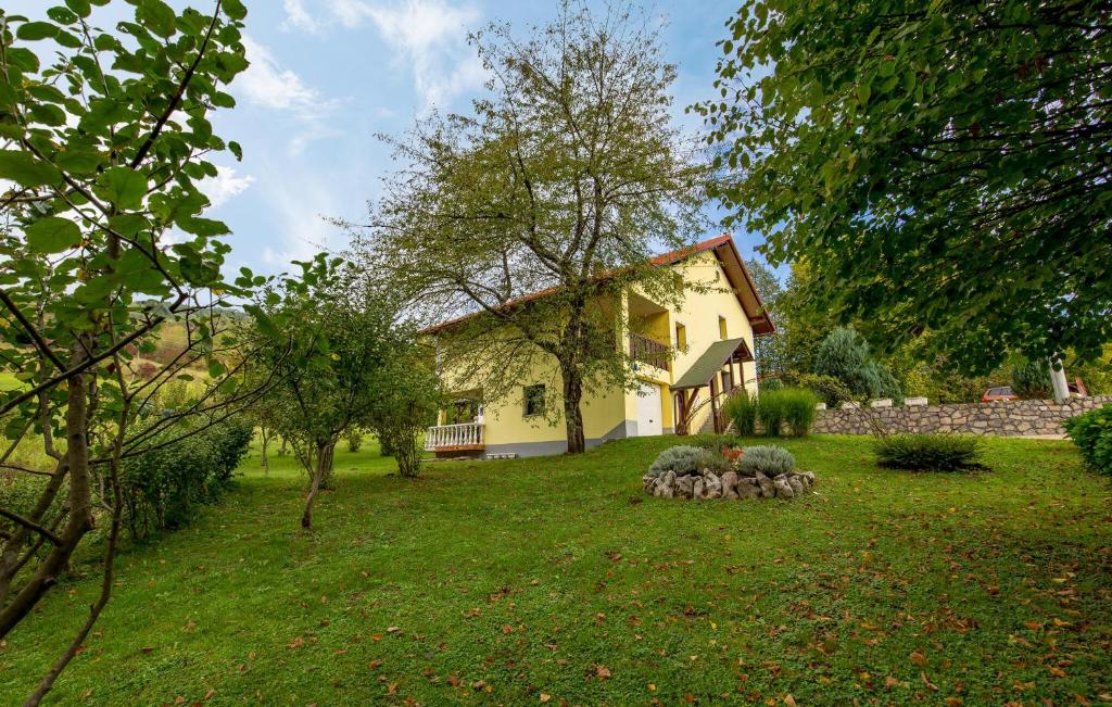 a group of sheep standing in a yard in front of a house at Amazing Apartment In Vrbovsko With Sauna in Vrbovsko