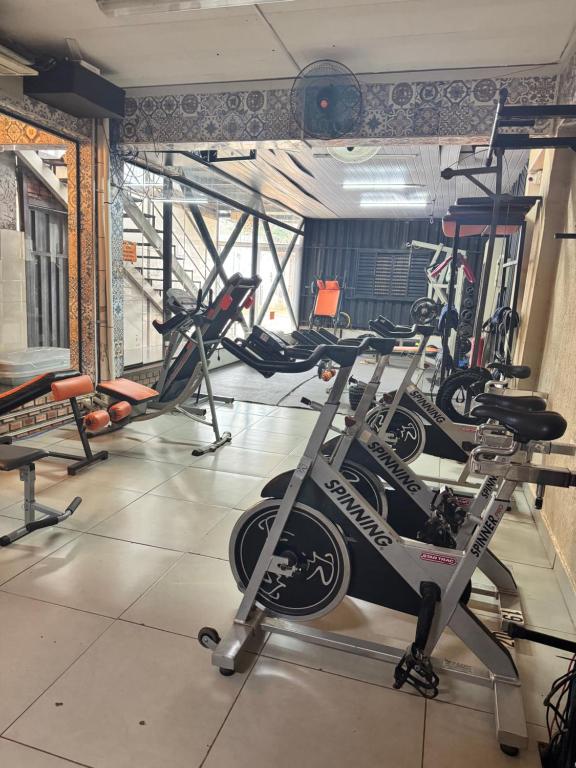 a gym with several exercise bikes in a room at Los Monges Aparthotel in Ciudad del Este