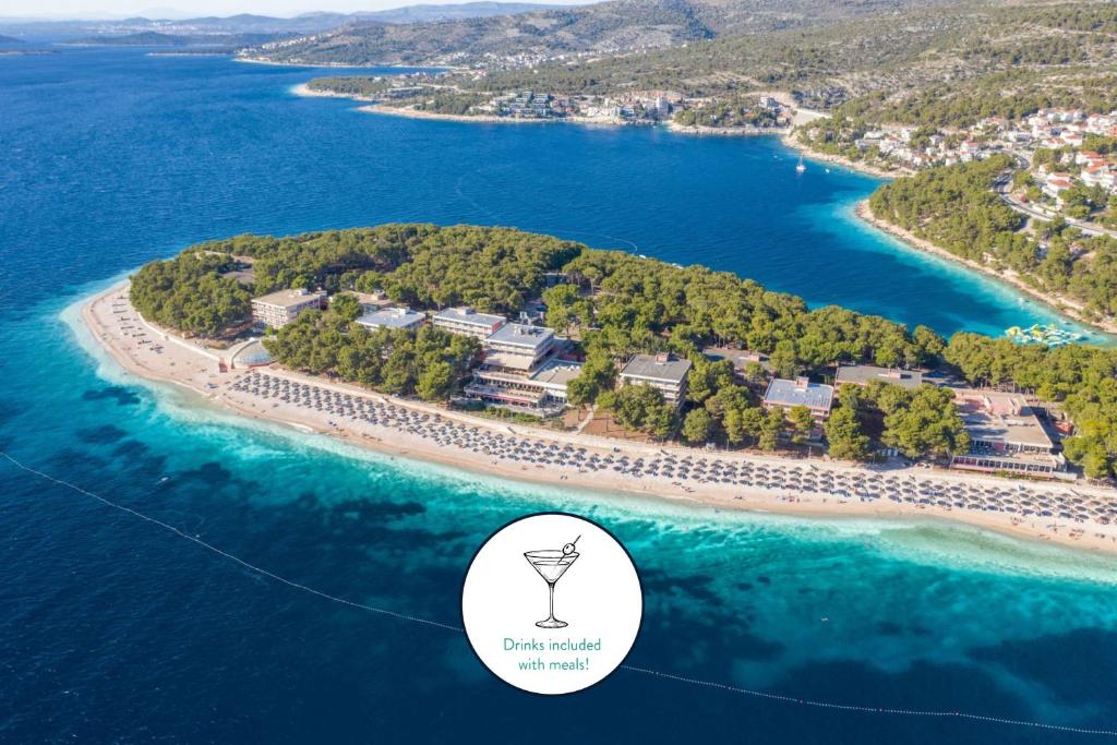 an island in the water with a sign that reads island resort at Hotel Zora in Primošten