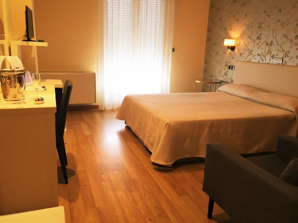 Cama o camas de una habitación en Hotel Playa de Laxe