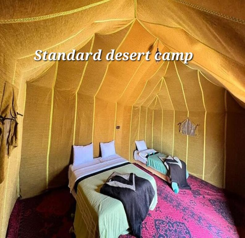 Ένα ή περισσότερα κρεβάτια σε δωμάτιο στο Standard Desert Camp