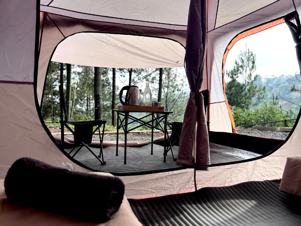 a tent with a view of a table in it at KAIA Camp by Kalimaya in Cicadas