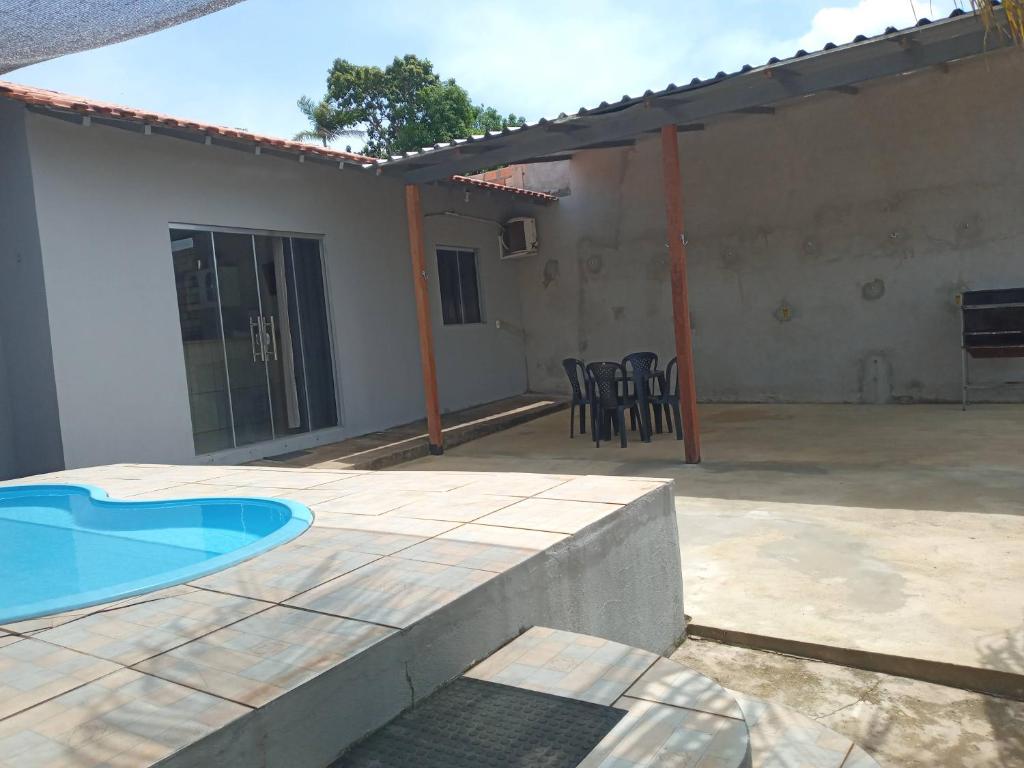 a patio with a swimming pool and a house at Alter do Chão Casa 02 in Alter do Chao