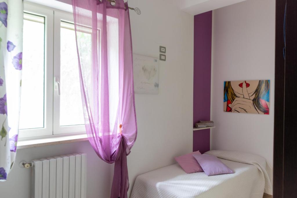 Postel nebo postele na pokoji v ubytování Villa Pasitea - Nature & Sea Retreat in Gargano, Puglia