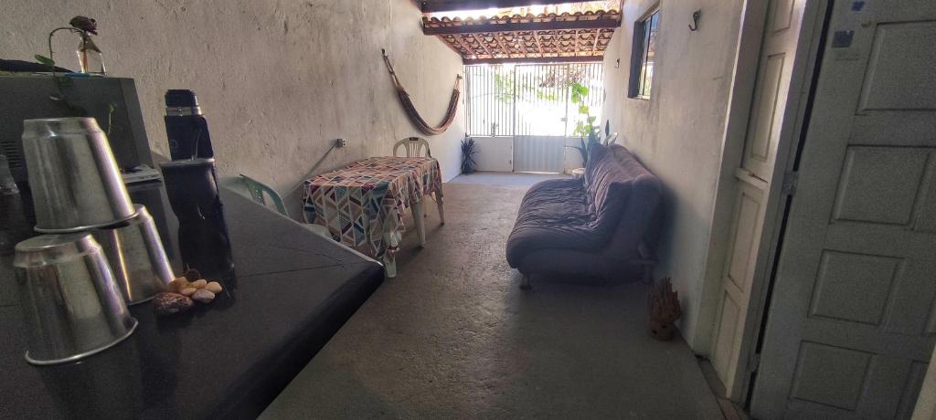 a hallway with a couch and a table in a room at Shantti House in Pipa