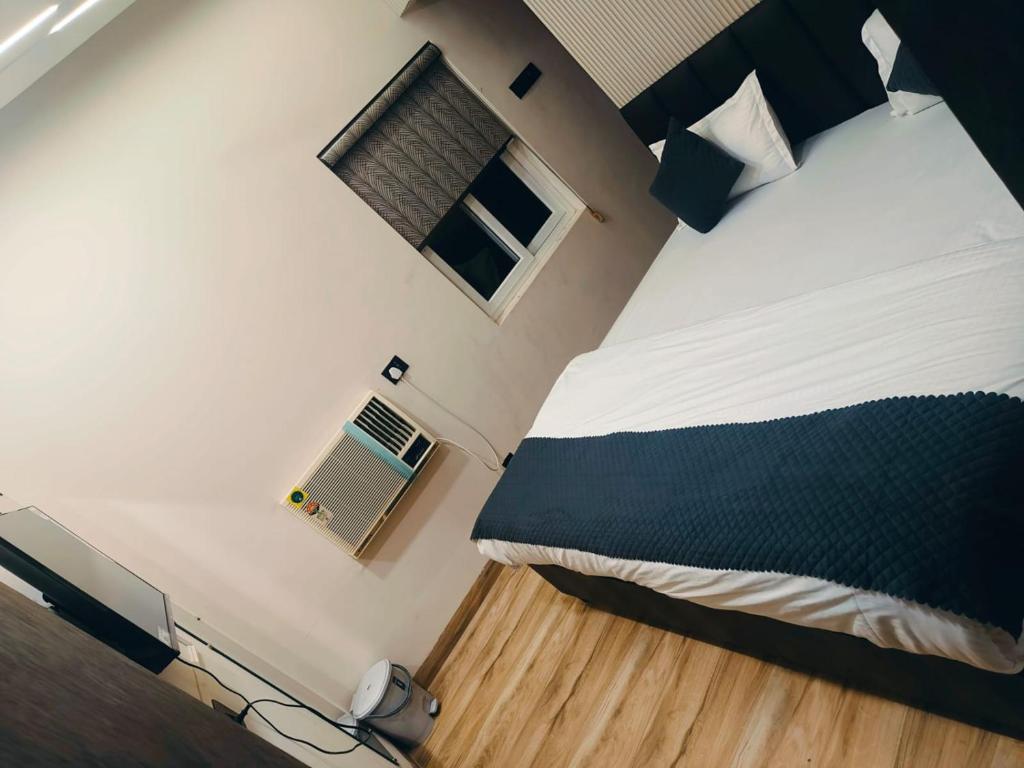 Ένα ή περισσότερα κρεβάτια σε δωμάτιο στο Hotel MRK VILLA