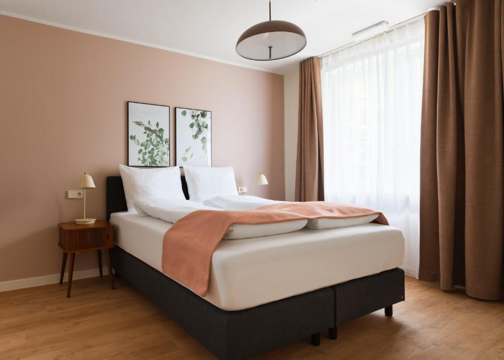 Ένα ή περισσότερα κρεβάτια σε δωμάτιο στο Limehome Kortrijk Gentsestraat