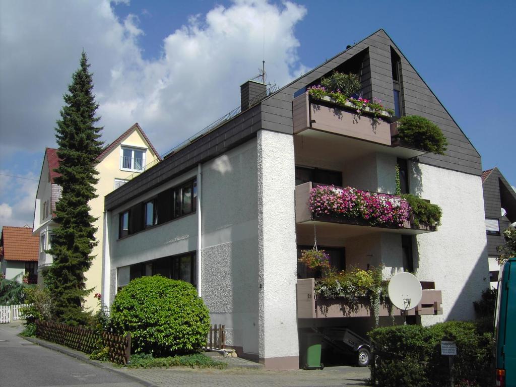 a house with flower boxes on the side of it at WohnZeit Stuttgart in Stuttgart