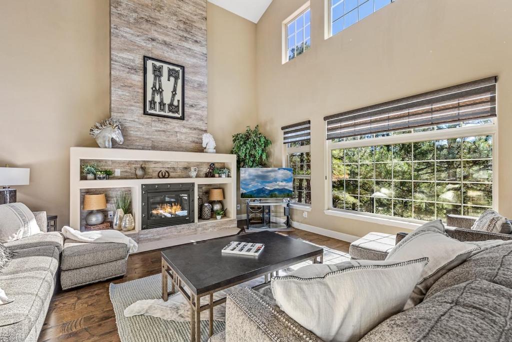 a living room with couches and a fireplace at Minutes 2 NAU & downtown & Snowbowl! in Flagstaff