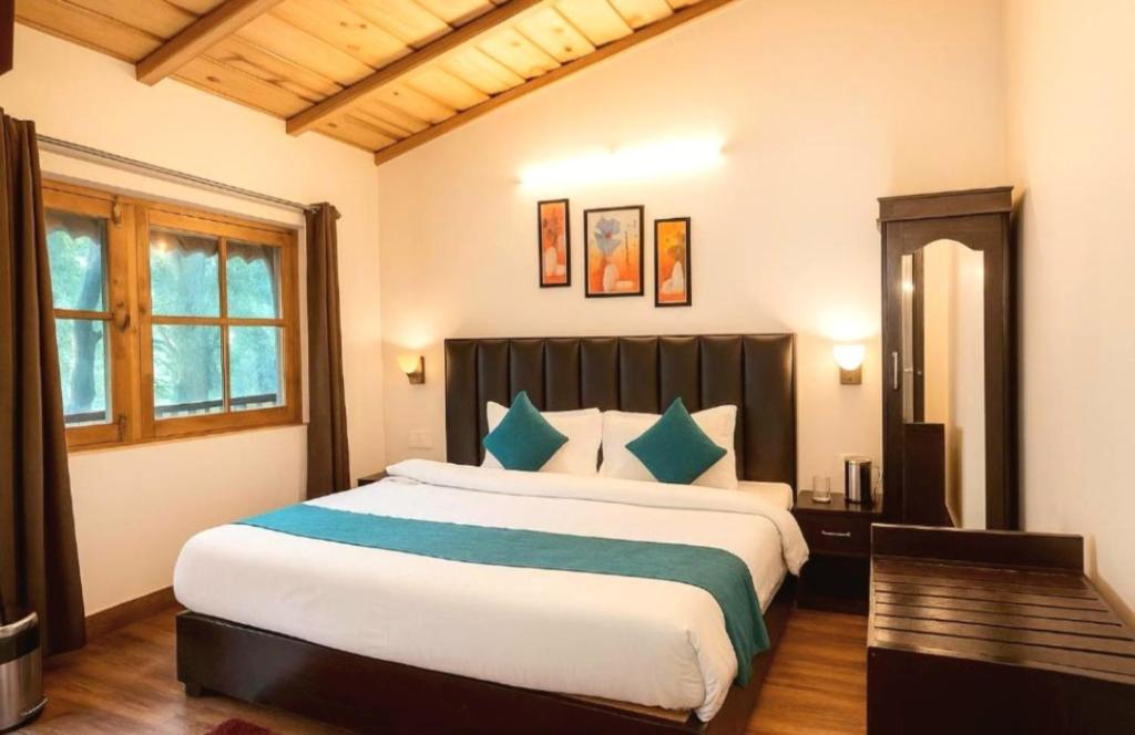 Postel nebo postele na pokoji v ubytování The Boho Woods Resort