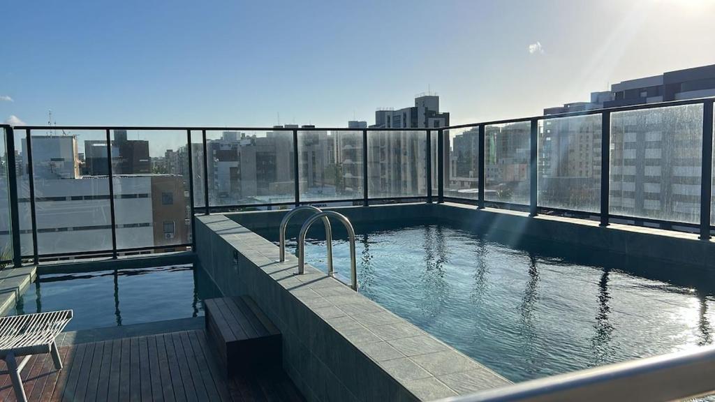 a swimming pool on the top of a building at Flat - Beira-Mar - Piscina - Intermares in Cabedelo