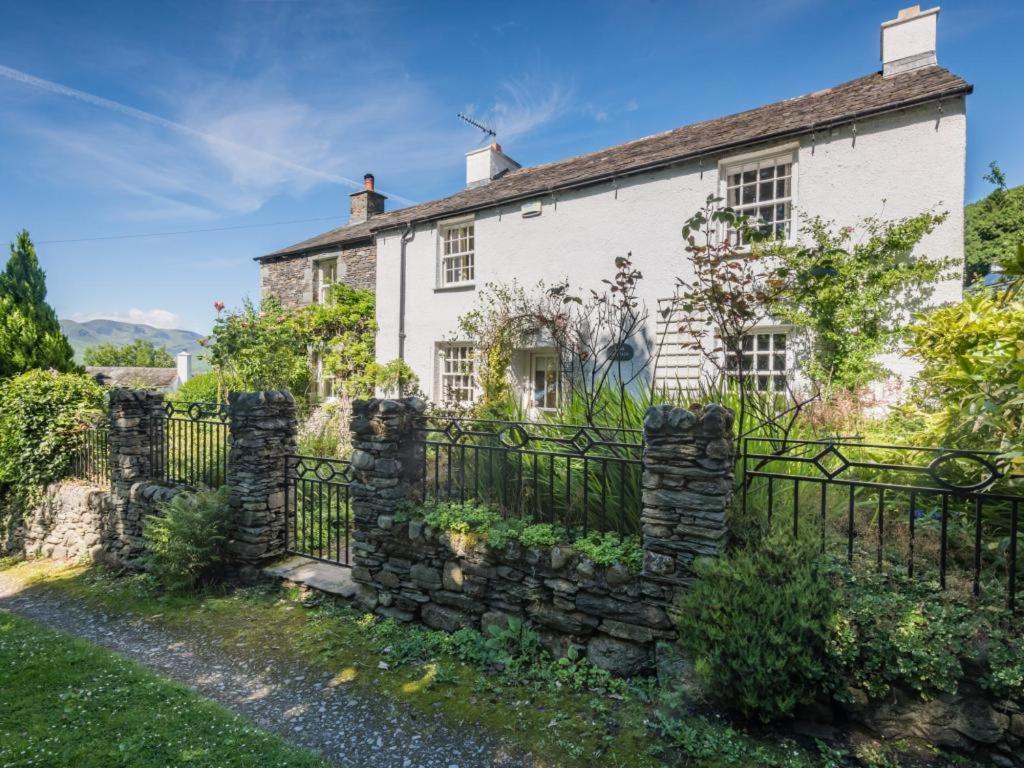 an old stone house with a stone fence at 4 Bed in Keswick oc-sz434 in Applethwaite