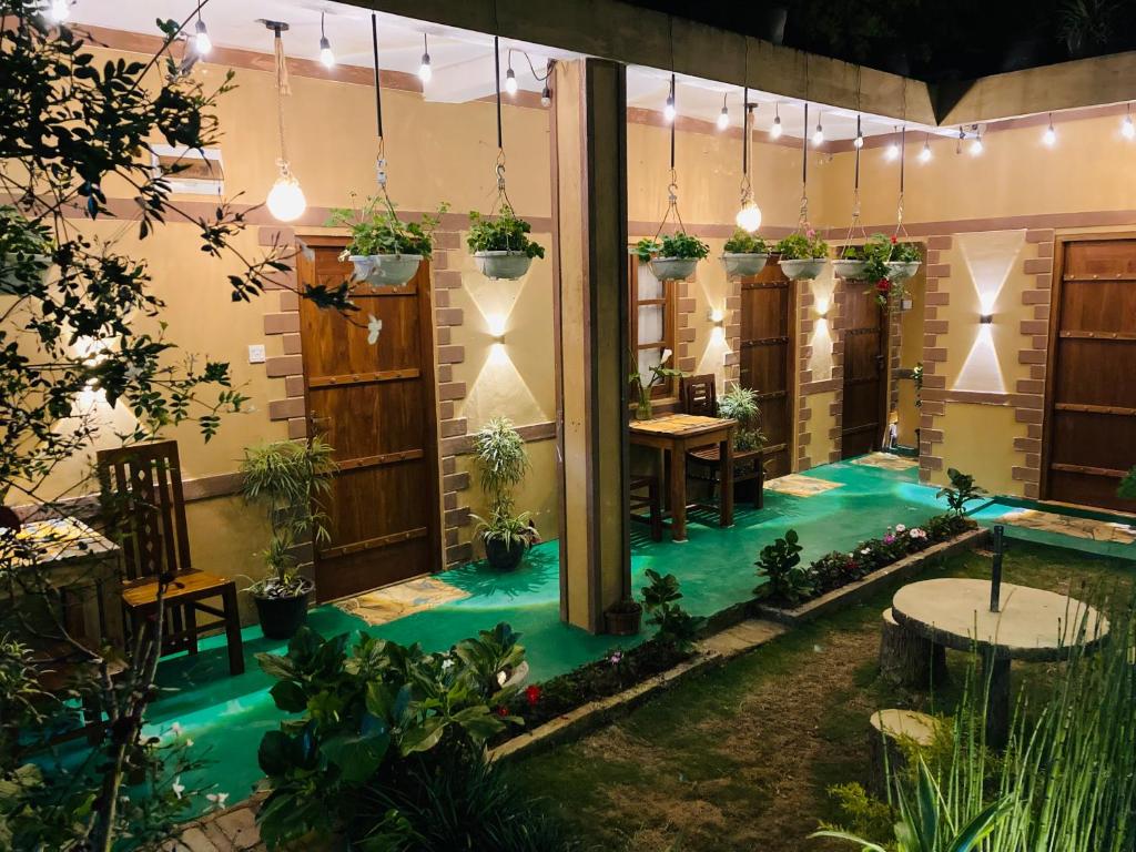 a house with an artificial pool in the middle of a room at Lily Bank Cottage in Nuwara Eliya