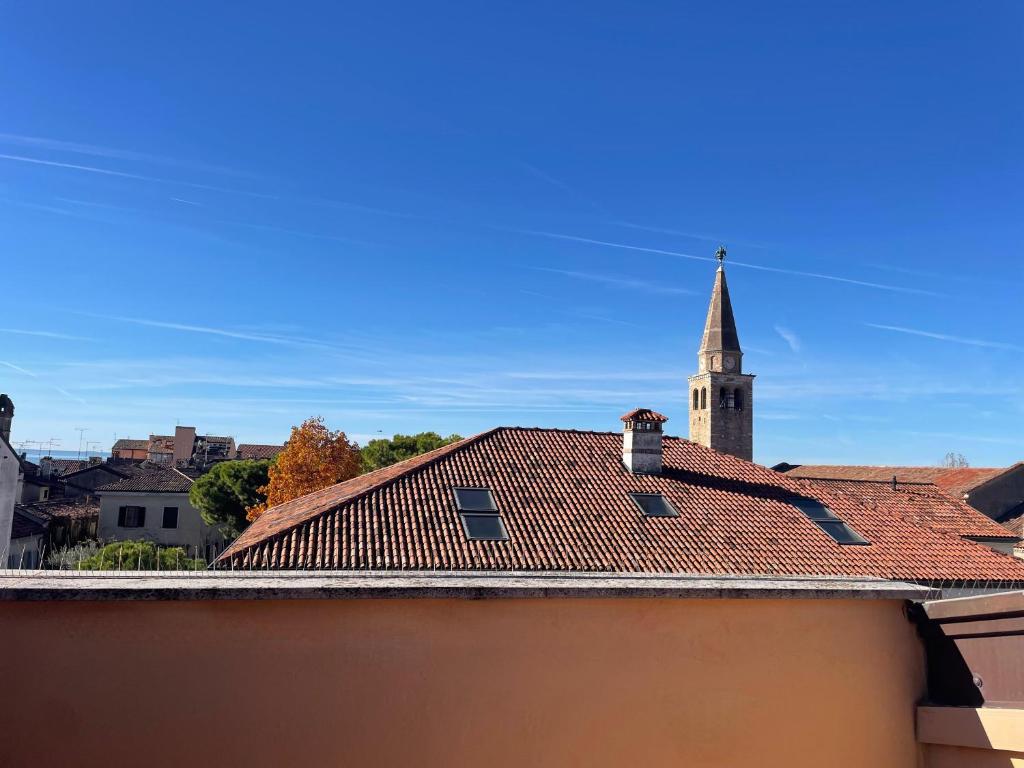 a view of a building with a church steeple at Alessia in Grado