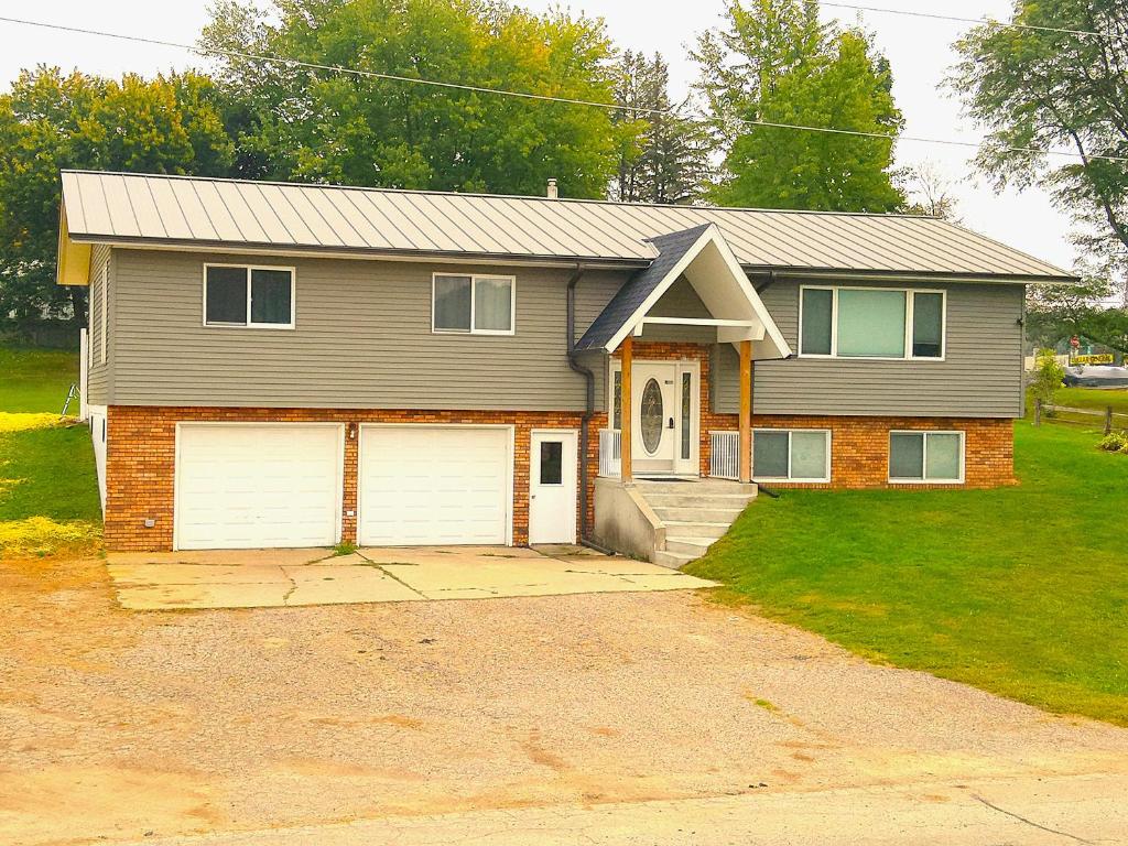 a house with a garage at Hot Tub/Snowmobile Trails/The Hemlock in Reedsburg