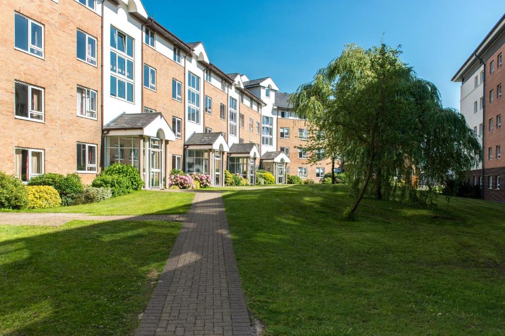 a brick pathway in front of a building at Lancaster University in Lancaster