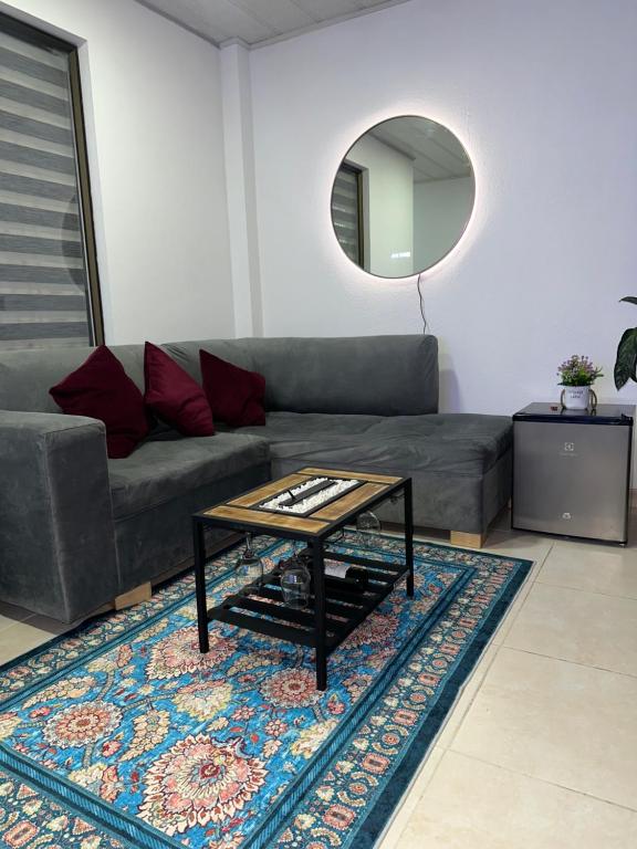 a living room with a couch and a table at Guatavita Loft - Apartamento in Guatavita