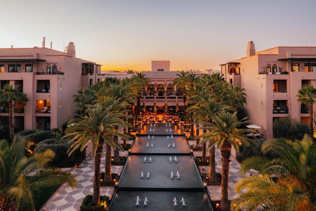 an aerial view of a hotel with palm trees at Four Seasons Resort Marrakech in Marrakech