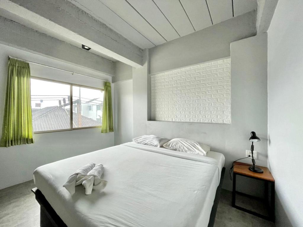 Ένα ή περισσότερα κρεβάτια σε δωμάτιο στο THT by Thai Hotel Krabi