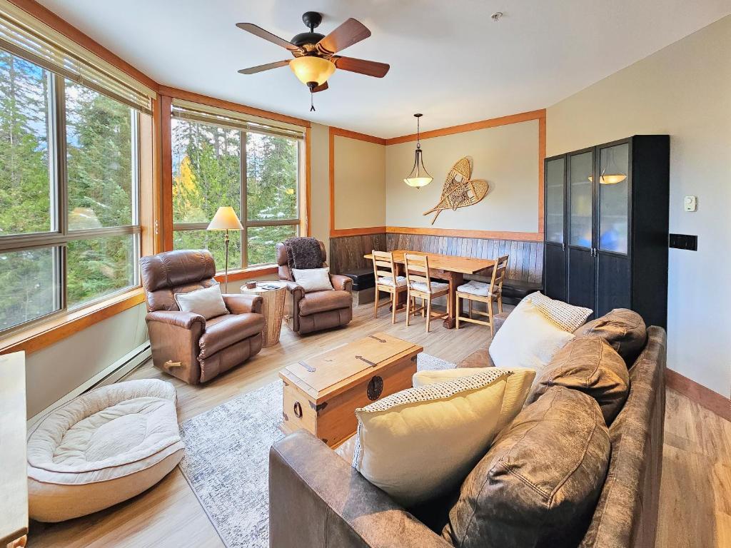 a living room with a couch and a table at Timberline Lodges by Fernie Lodging Co in Fernie