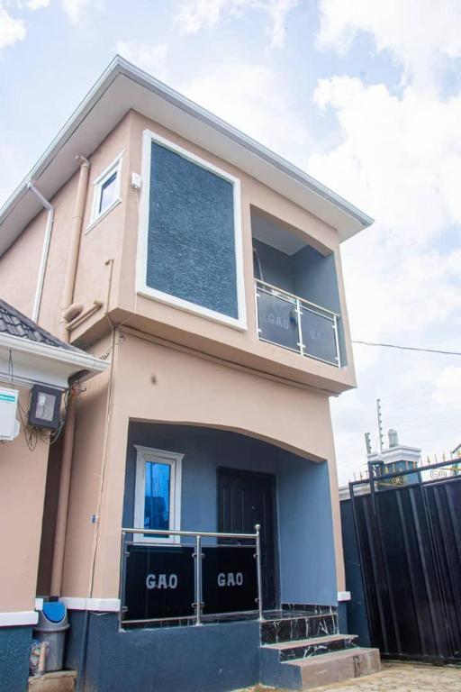 a house with a large window on top of it at GAO-Apartments in Egbelu